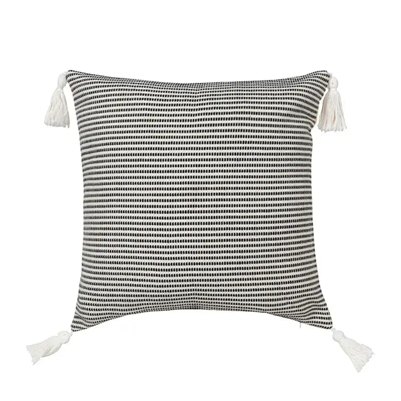 Boho black and white jacquard flower pillow case with woven texture and matching tassels for living room decor by decorbites