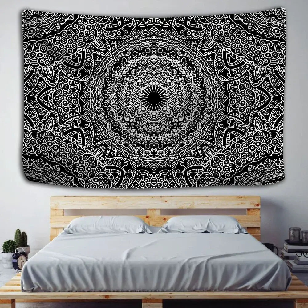 Boho black and white mandala tapestry with intricate swirling patterns hanging as a decorbites indian mandala wall hanging above a wooden bed frame