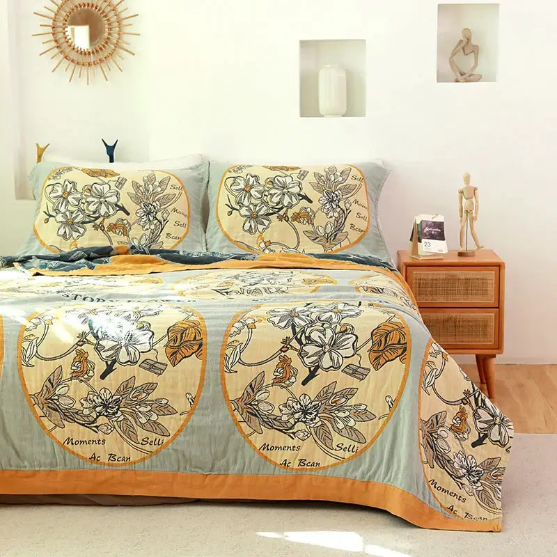 Boho blue and cream quilted cotton cover blanket with floral gold accents for sofa chair decor by decorbites boho cotton