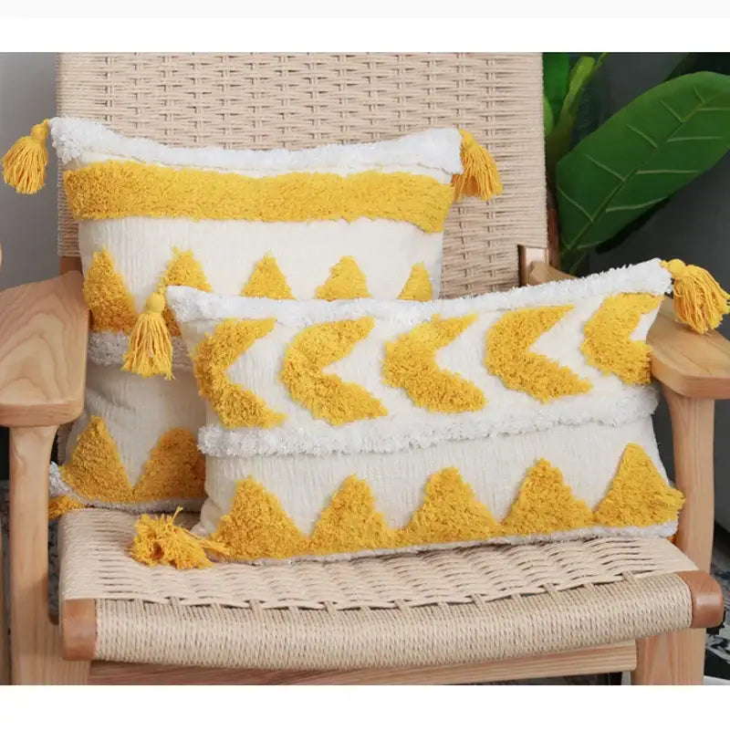 Cream-colored boho chenille tufted pillow case with mustard-yellow tassels and geometric patterns for living room decorbites decor