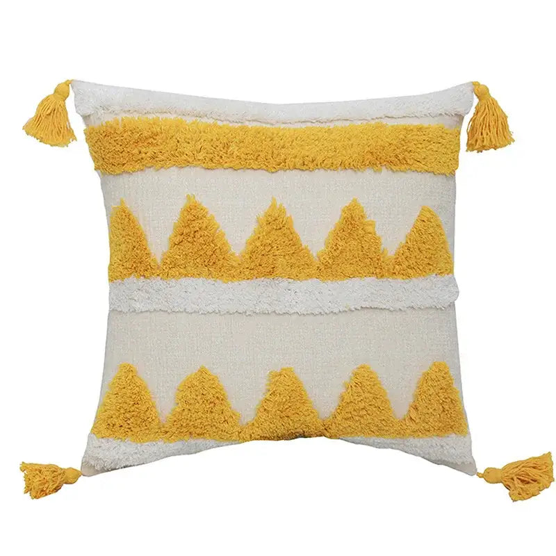 Cream-colored pillow case with mustard-yellow textured triangular stripes and tassels for decorbites boho chenille tufted decor