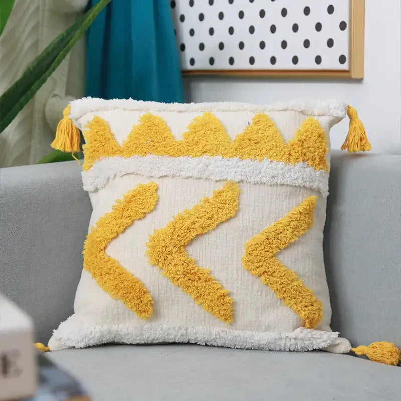 Cream-colored boho chenille tufted pillow case with vibrant yellow tassels and geometric patterns for living room decorbites decor