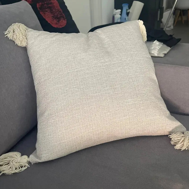 Beige linen boho chenille tufted pillow case with cream tassels for cream and mustard living room decor by decorbites