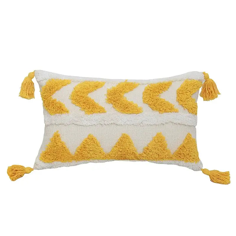 Cream-colored boho chenille tufted pillow case with mustard-yellow chevron patterns and tassels for living room decorbites decor
