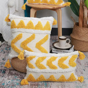Cream-colored boho chenille tufted pillow case with mustard yellow tassels for living room decorbites decor