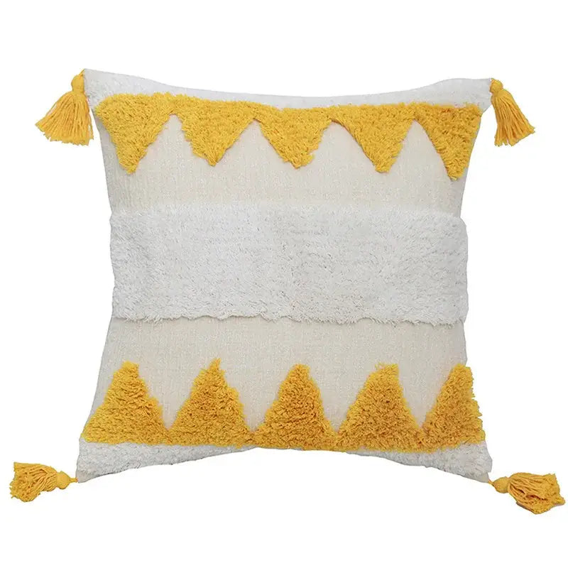 Cream-colored boho chenille tufted pillow case with mustard-yellow triangular tassels for living room decor