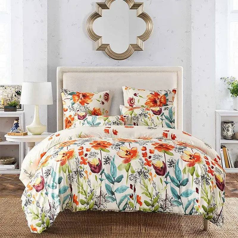 Boho chic decorbites bedding set featuring a vibrant floral comforter with orange teal and burgundy flowers on cream background