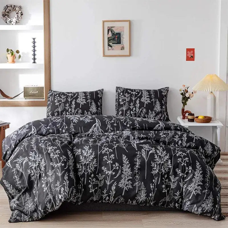 Boho chic black and white botanical bedding set featuring a duvet cover with white illustrations for bedroom decorbites boho chic