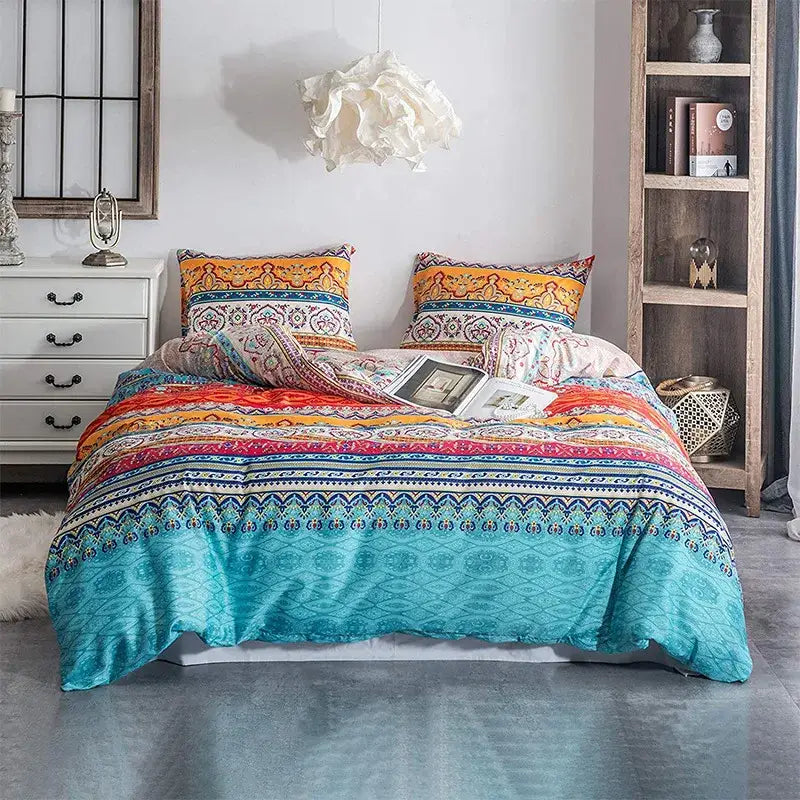 Boho chic bedding set featuring vibrant turquoise and orange patterned bedspread with intricate geometric designs by decorbites