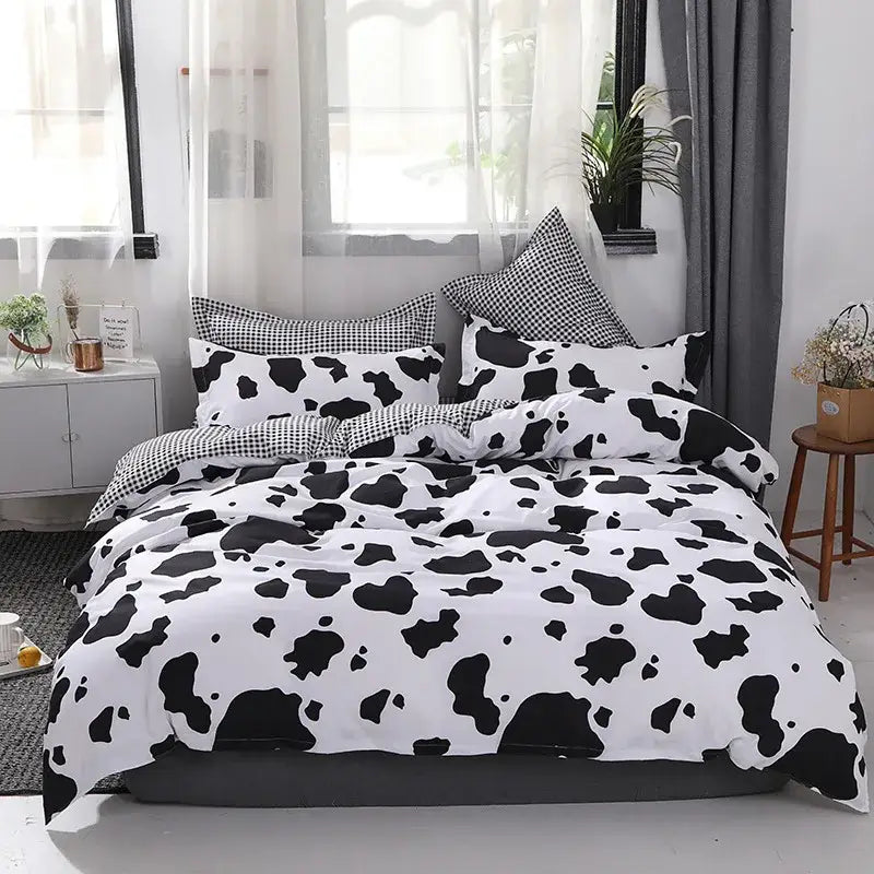 Boho chic black and white botanical bedding set with playful cow print pattern for stylish bedroom decorbites boho chic