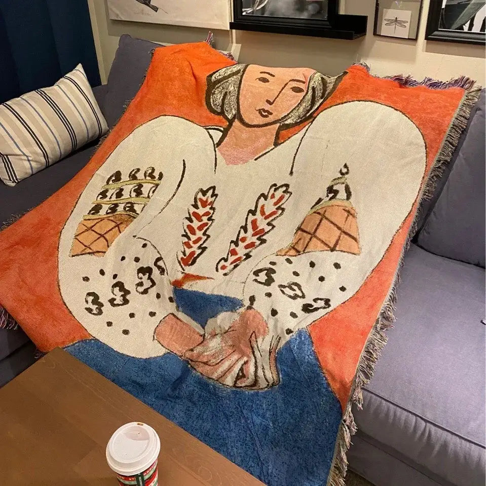Cozy orange white and blue woven boho chic throw blanket with stylized woman holding wheat stalks decorbites chic throw blanket