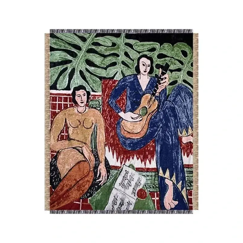 A decorbites boho chic throw blanket featuring a woven tapestry with two women and orange blue leopard print accents