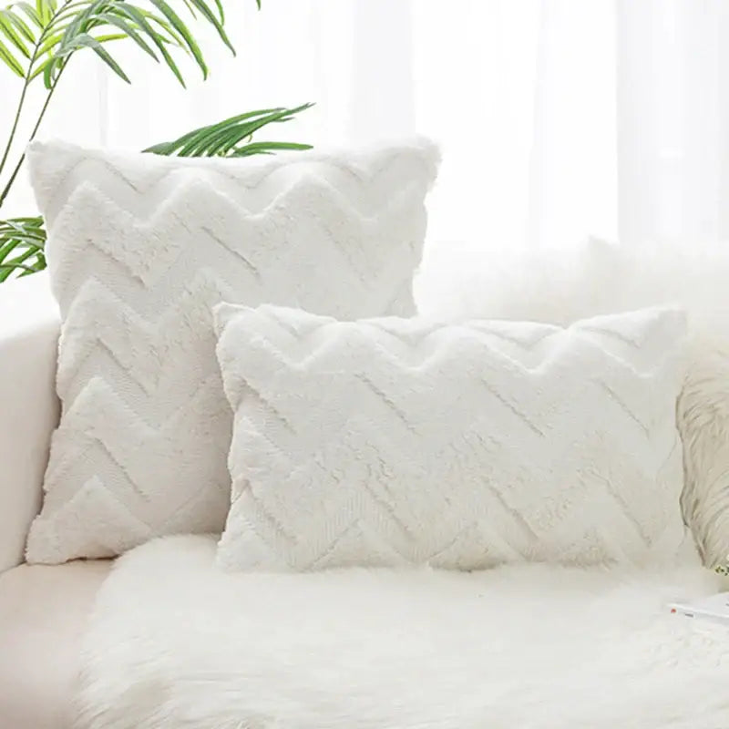 White fluffy boho chic pillow cover with textured faux fur chevron pattern for bedroom decor by decorbites