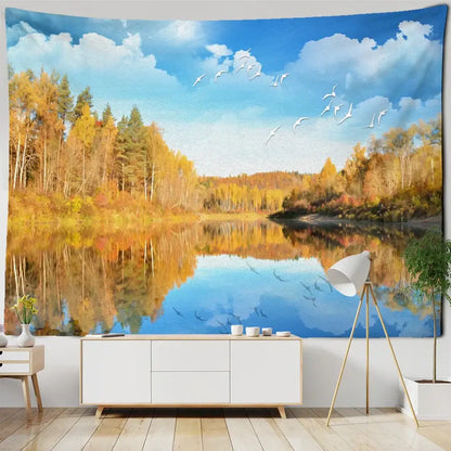 Boho coastal cave tapestry wall hanging featuring vibrant golden trees, reflective lake, and white birds for seaside decorbites coastal cave decor