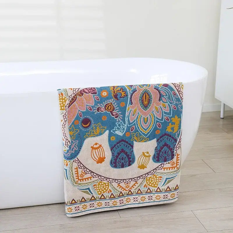 Boho cotton gauze bath towel with vibrant blue pink and gold elephant design and beige paisley decorbites boho cotton wrap