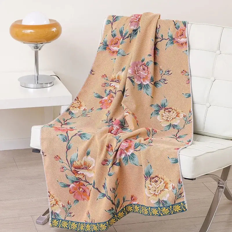 Beige floral throw blanket with pink and peach roses green leaves and yellow border in decorbites boho cotton gauze bath towel wrap