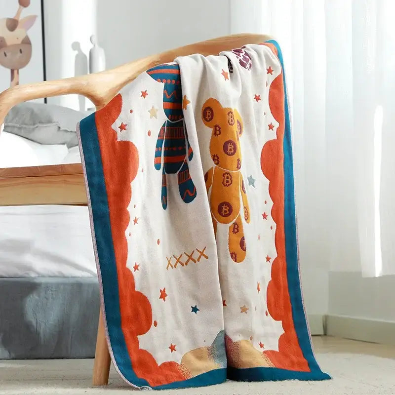 A cozy beige and blue paisley bath towel with playful bear and sock design from decorbites boho cotton gauze