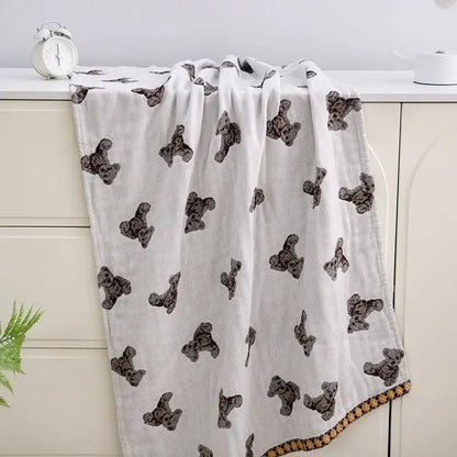 White blanket with black teddy bear prints and brown checkered border in decorbites boho cotton gauze bath towel design