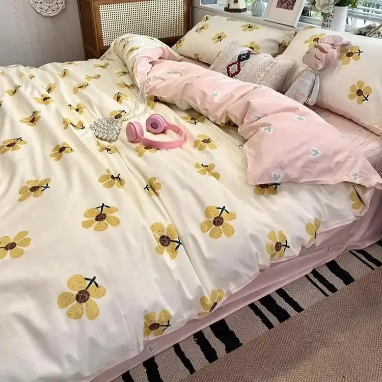 Yellow floral patterned duvet cover with pink accents and matching pillowcases in decorbites boho cotton printed bedding set
