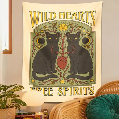 A cream boho cat hearts tapestry wall hanging featuring two black cats yellow eyes and decorative suns and moons for decorbites cat hearts