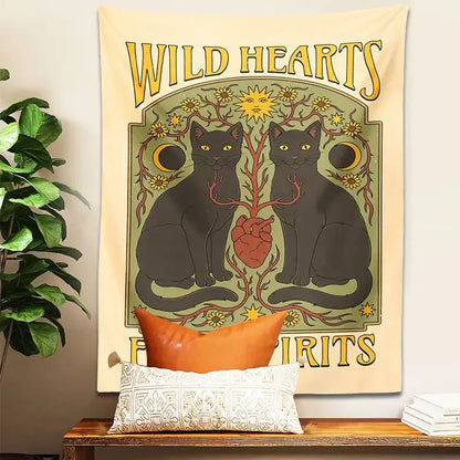 A cream-colored boho cat hearts tapestry wall hanging with two black cats yellow eyes red heart and gold sun moon decorbites cat hearts