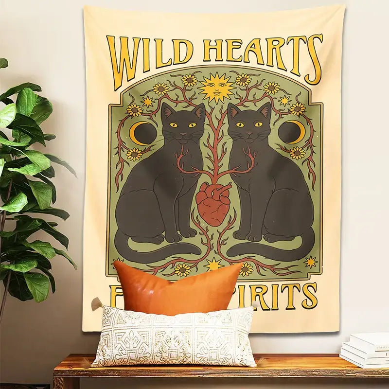 A cream-colored boho cat hearts tapestry wall hanging with two black cats yellow eyes red heart and gold sun moon decorbites cat hearts