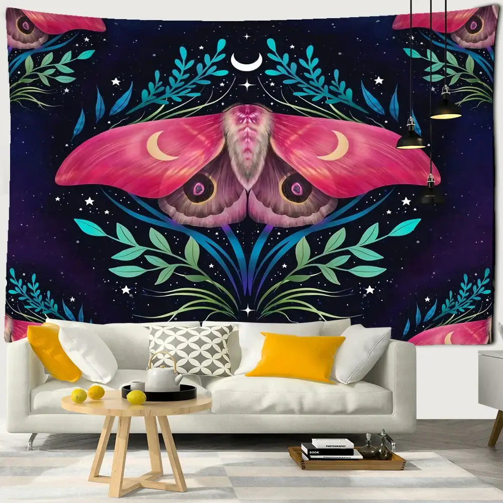 Vibrant pink and purple moth decorbites butterfly tapestry with celestial design hanging above white sofa