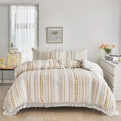 Beige and cream striped duvet set with pom pom trim and fringe detailing from decorbites boho stripe collection