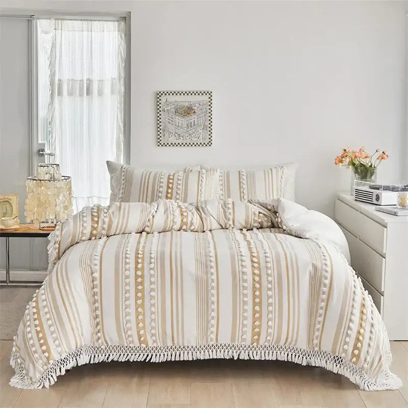 Boho cream and beige striped duvet set with pom pom accents and macramé fringe by decorbites boho stripe furball