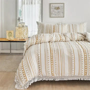 Boho cream and beige striped duvet set with white pom-pom trim and fringe detailing by decorbites boho stripe furball