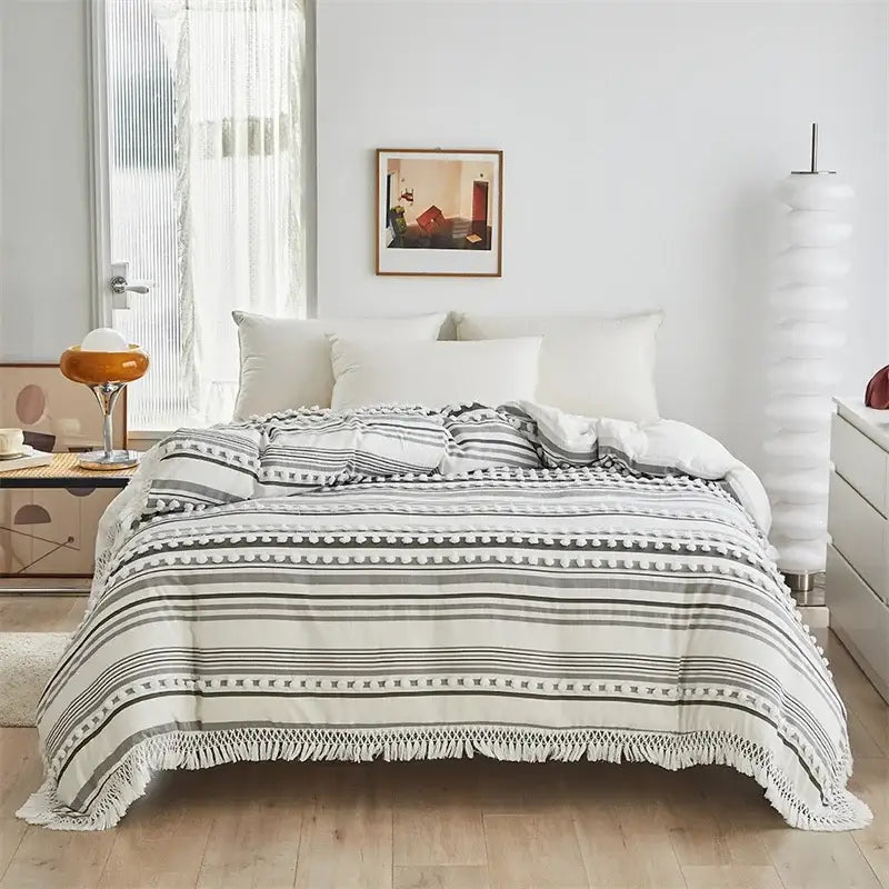 A cozy cream-colored duvet set with black and gray boho stripe furball fringe detailing by decorbites boho stripe