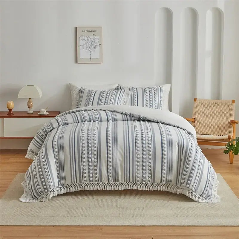 Gray and white striped quilted duvet set with textured pom-pom detailing from decorbites boho stripe furball collection