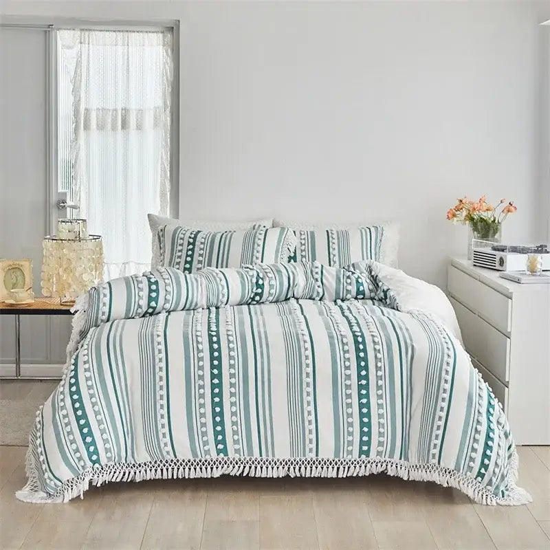 Teal and white striped duvet set with fringe detailing from decorbites boho stripe furball collection for stylish bedding