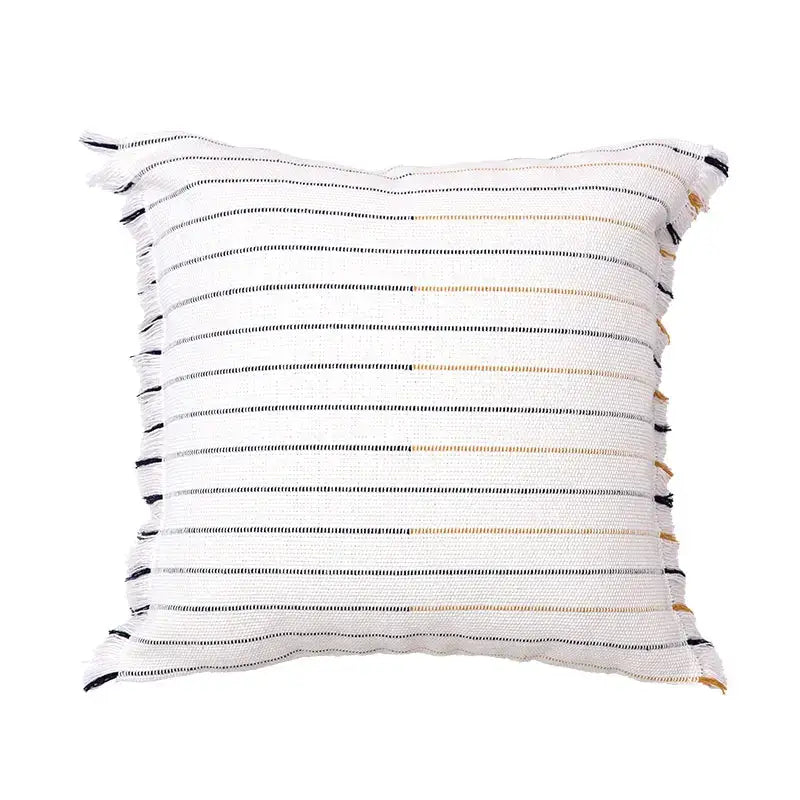 Boho cream and black handmade cotton woven cushion with textured black and beige stripes and frayed edges for living room decor