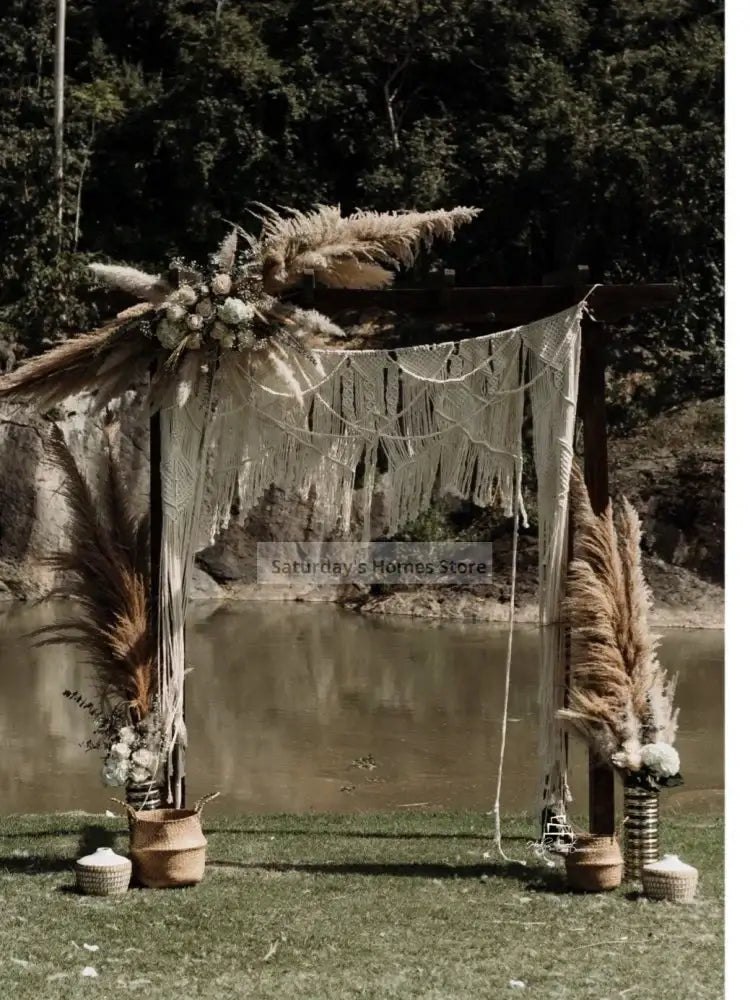 Beige boho cream cotton macrame wedding backdrop with pampas grass and white flowers for decorbites cotton macrame decor