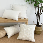 Cream-colored cushion cover with lace floral embroidery ruffled edges and pom pom trim decorbites boho white pillow