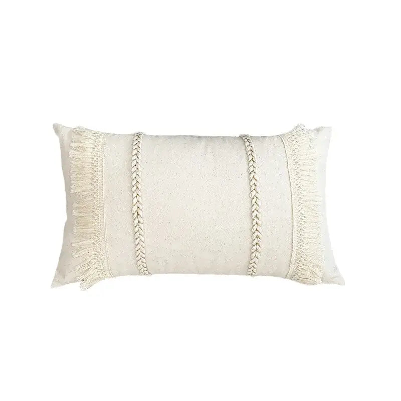 Cream-colored boho cushion cover with lace floral texture, braided cord accents, and fringed edges by decorbites boho white
