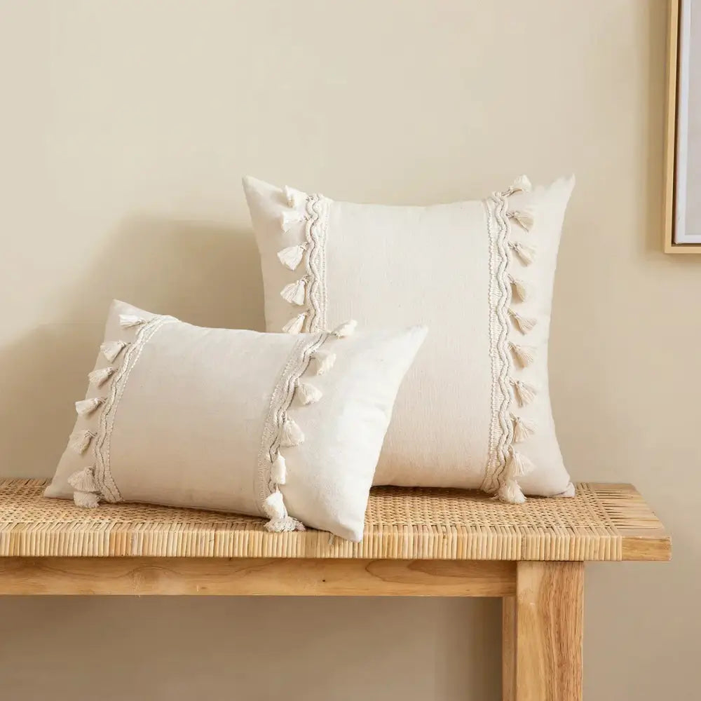 Cream-colored rectangular cushion cover with lace floral texture and tassel trim for decorbites boho white decor