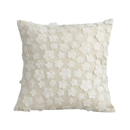 Off-white square cushion cover with delicate lace floral appliqués for boho decorbites boho white living room design