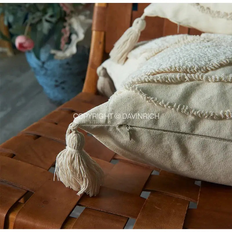 Cream-colored linen cushion cover with textured embroidery and fluffy tassel decorbites boho leaf geometry tufted cushion