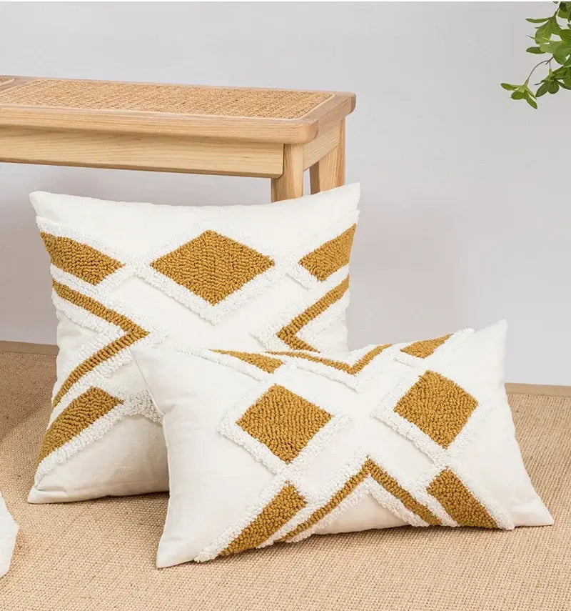 Cream-colored cushion cover with textured mustard-yellow geometric tufted fringe design for living room decor