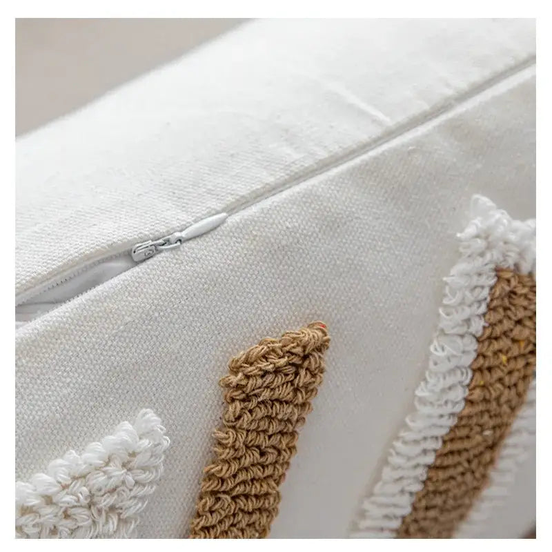 Boho cream and tan cushion cover with white linen and textured beige crochet tufted fringe for living room decor