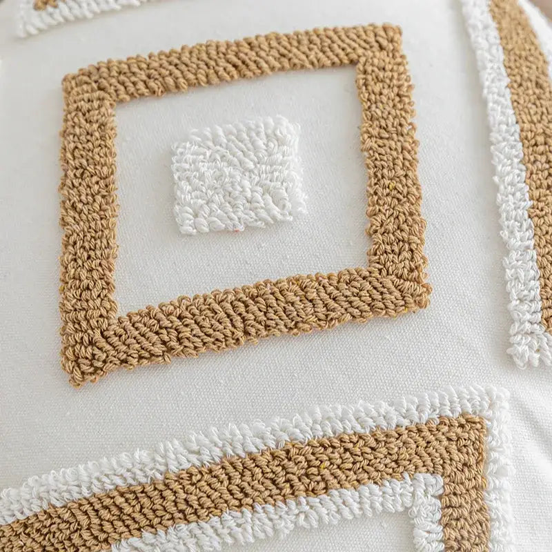 Boho cream and tan geometric textured crochet cushion cover with tufted fringe for living room decor