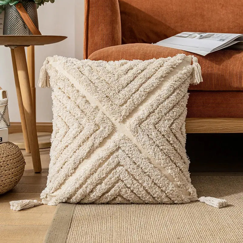 Cream textured cotton pillow cover with geometric v-shaped pattern and tassels by decorbites boho cotton tassel decor