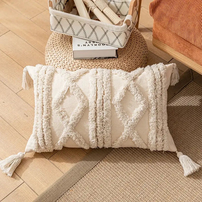 Cream-colored boho cotton tassel pillow cover with textured woven tassels and diamond-patterned fringe decorbites boho cotton