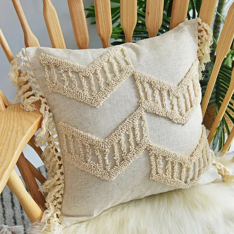 Beige linen pillow cover set with cream macrame embroidery and fringe detailing for a boho bedroom decor