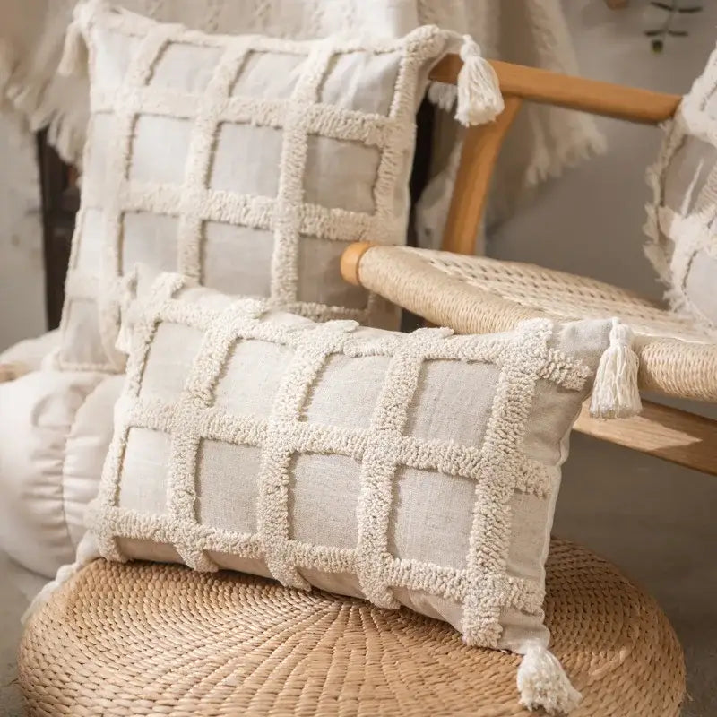 Cream-colored rectangular pillow cover set with textured grid pattern and tassels for boho bedroom decor