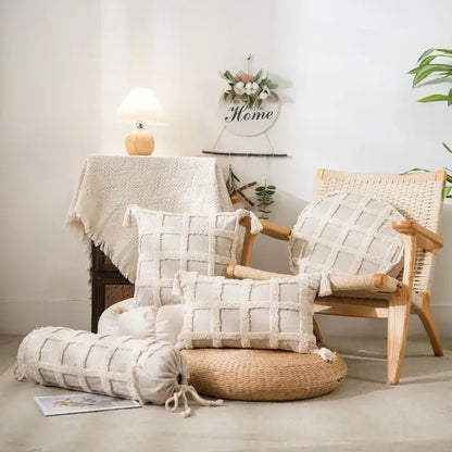 Boho cream textured round lumbar pillow cover set with woven grid pattern and tassel details for bedroom decor