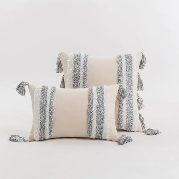 Beige boho cream tufted cushion cover with textured gray and white vertical stripes and tassels for living room decor