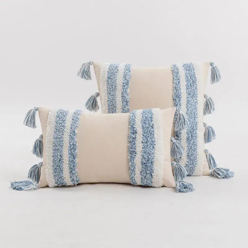 Beige boho cream tufted cushion cover with textured blue and white stripes and tassels for living room decor